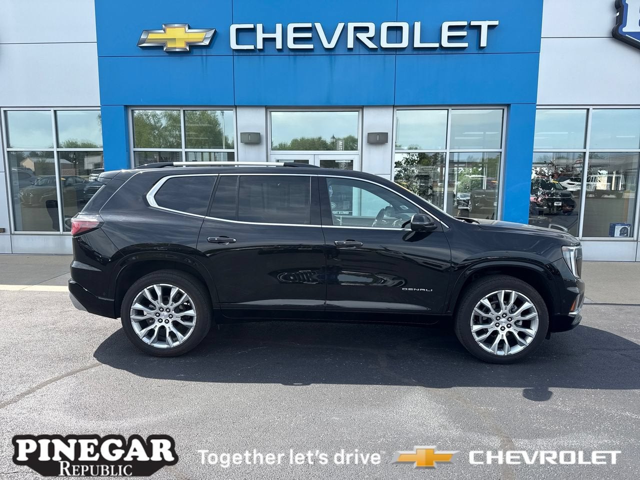 2024 GMC Acadia Denali in Ebony Twilight Metallic — front three-quarter view