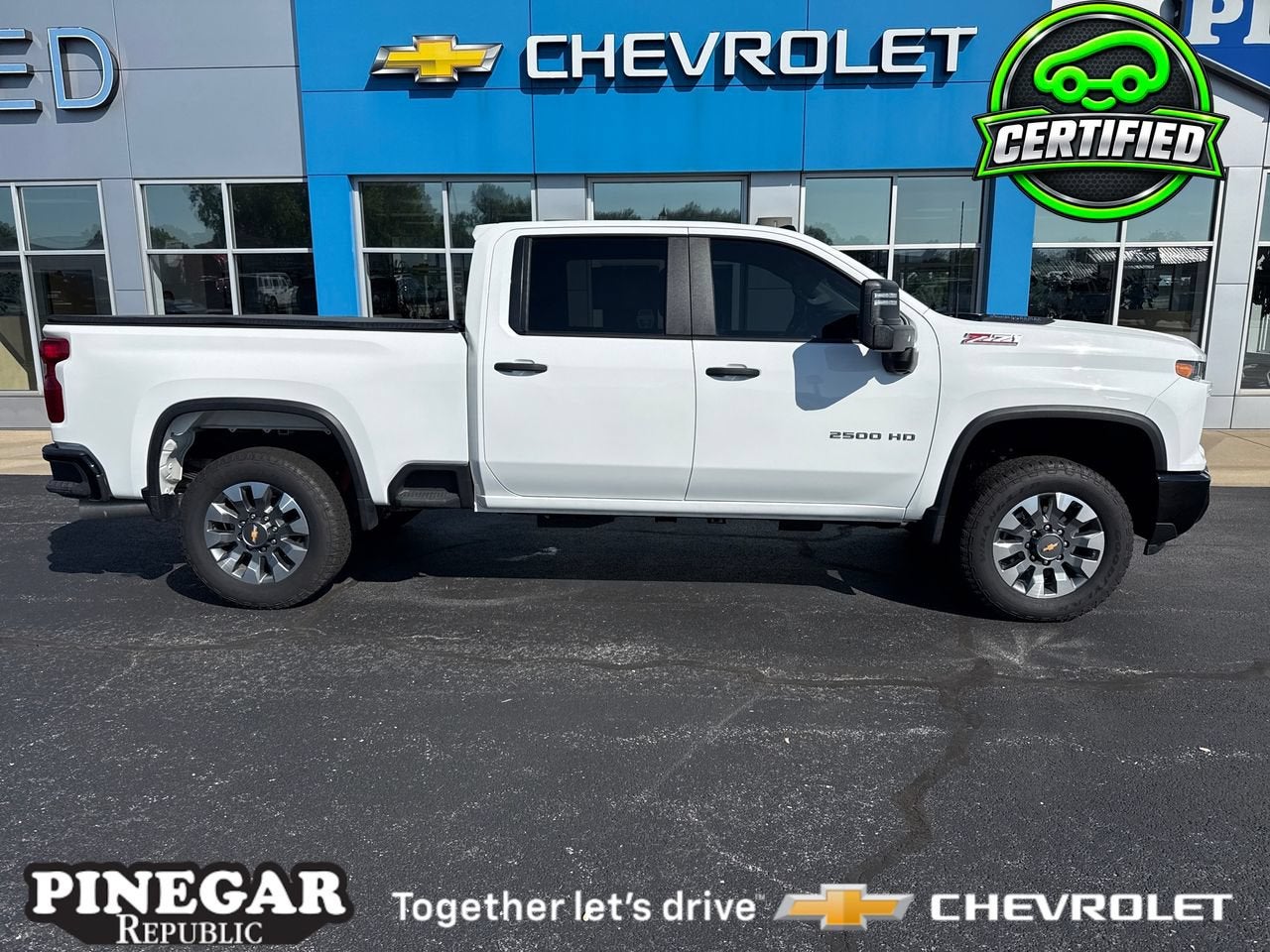 2025 Chevrolet Silverado 2500 HD Custom in Summit White — front three-quarter view