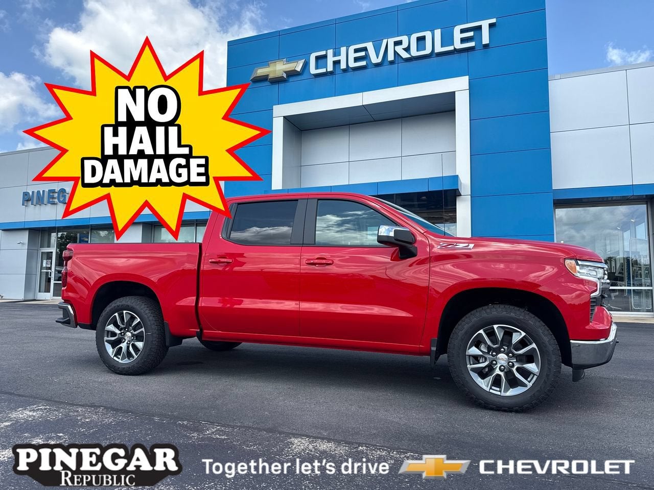 2026 Chevrolet Silverado 1500 LT in Red Hot — front three-quarter view